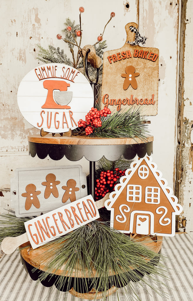 Experience the Holiday Magic with Our Adorable Gingerbread Tiered Tray Craft Set  The charm of miniature gingerbread people and their sweet homes is an iconic Christmas delight! Laser cut expertly from smooth, 1/8" hardwood plywood, these tiered tray sized pieces not only offer a fantastic surface to paint but also remain lightweight and easy to store between seasons.